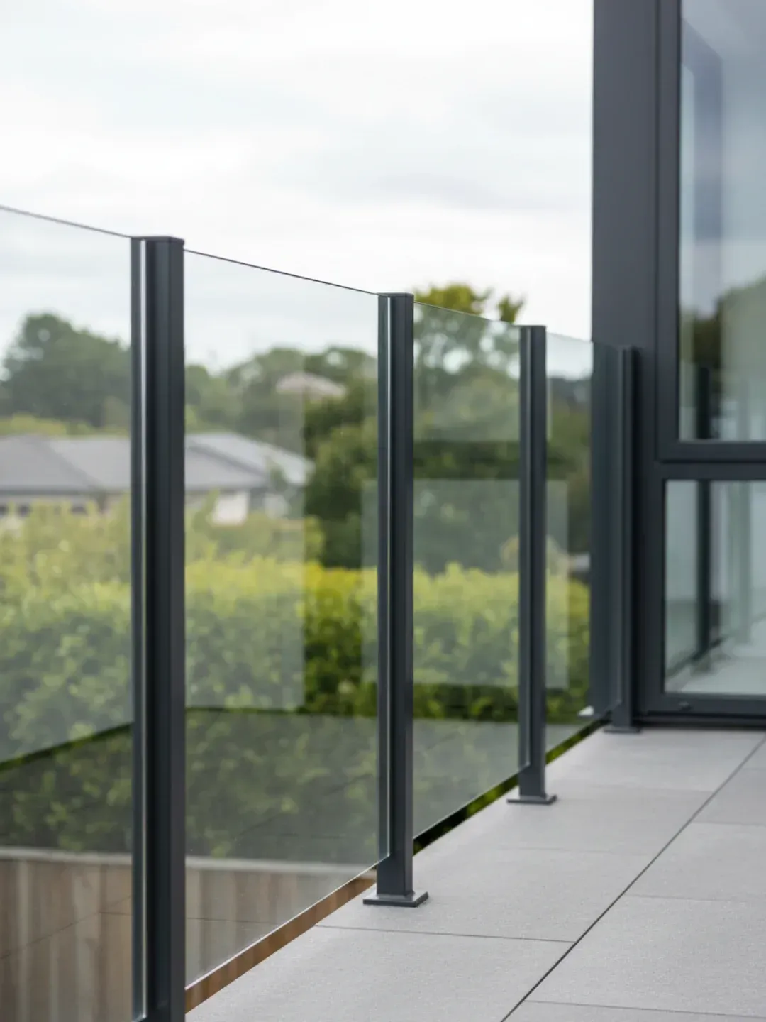 Semi-frameless glass balustrades west end with powder-coated aluminium posts and glass infill panels for robust compliance.